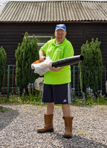 Worker holding leaf blower at The New Blendworth Centre